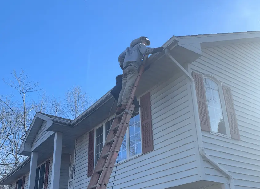 Gutter cleaning and maintenance being performed by Brook Park Power Washing in Brook Park